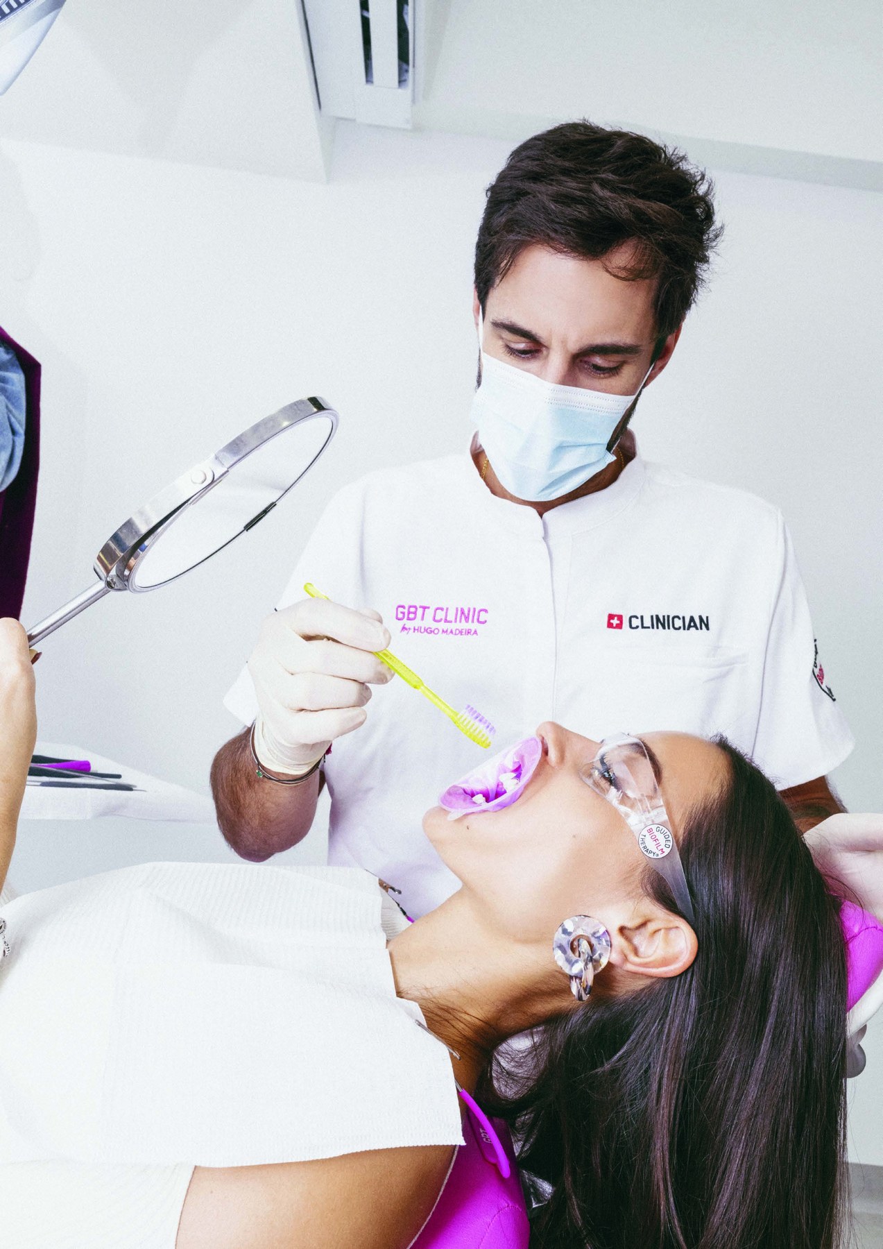 EMS Biofilm Discloser being applied during Guided Biofilm Therapy
